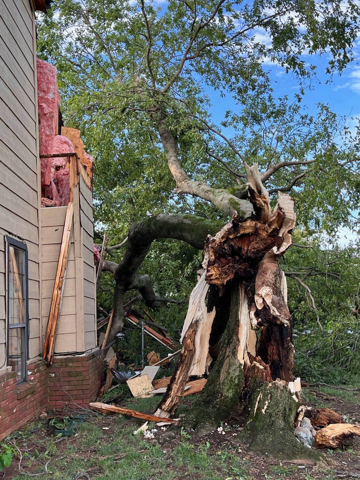 Fallen tree causing chimney damage in Tulsa Oklahoma